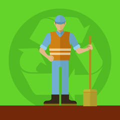 Sanitation worker with broom in front of a recycling sign