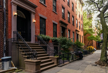 Brownstone facades & row houses at sunset in an iconic neighborhood of Brooklyn Heights in New York City