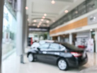 Blur image of car in the showroom
