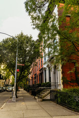 Brownstone facades & row houses at sunset in an iconic neighborhood of Brooklyn Heights in New York...