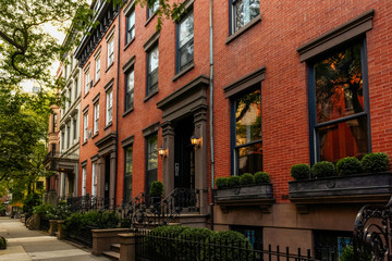 Brownstone facades & row houses at sunset in an iconic neighborhood of Brooklyn Heights in New York...