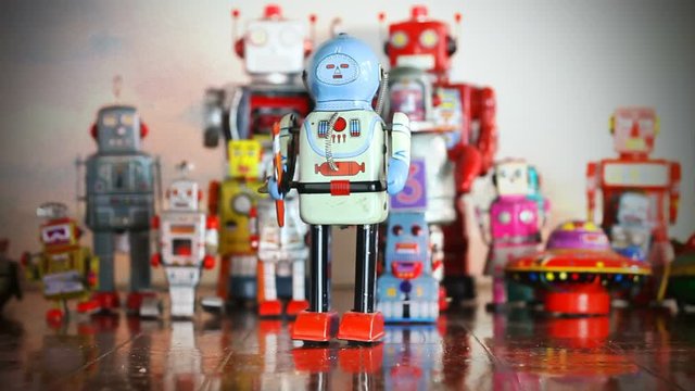retro tin toy robot waling 