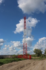 high tower radio station on the field to receive cellular signals antenna