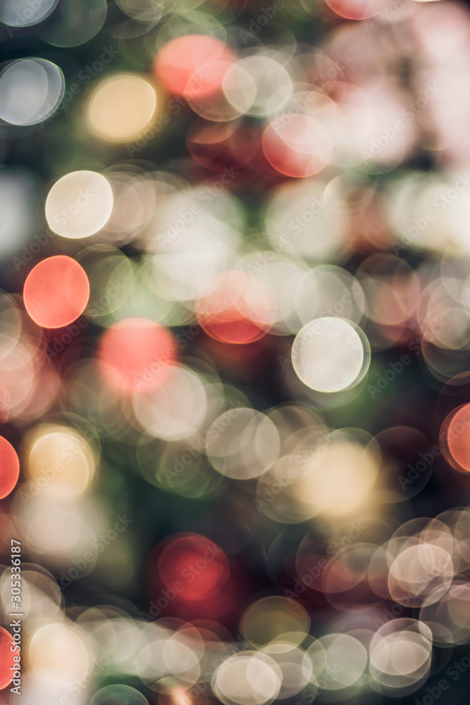 Aufkleber Abstract color blur decoration ball and light string on christmas tree with bokeh light background.winter holiday seasonal