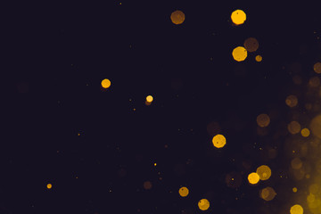 Abstract gold bokeh on black