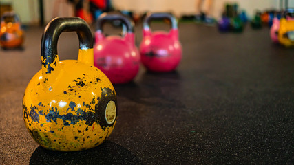 Kettlebells on gym. Close up. Work out with the kettlebells