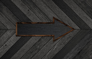 Wooden wall with arrow sign. Wood texture for background.	