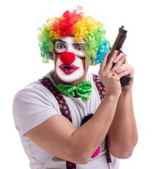 Funny clown with a gun pistol isolated on white background