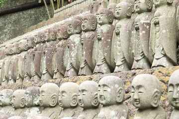 roll of Jizo Bodhisattva statues or statutes of baby buddha sat Hase-dera temple in Kamakura, Japan