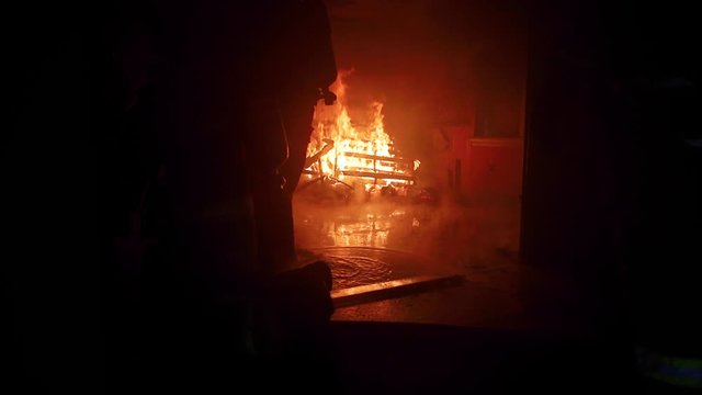 Live fire training burn with firefighters inside a burning room.