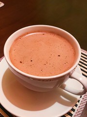 cup of coffee with chocolate and cream