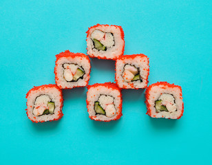 Japanese rolls on blue background.