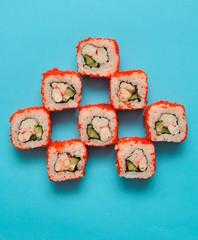 Japanese rolls on blue background.