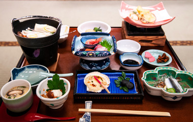 Fototapeta na wymiar Japanese cuisine dinner set. Kaiseki sashimi and winter cuisine