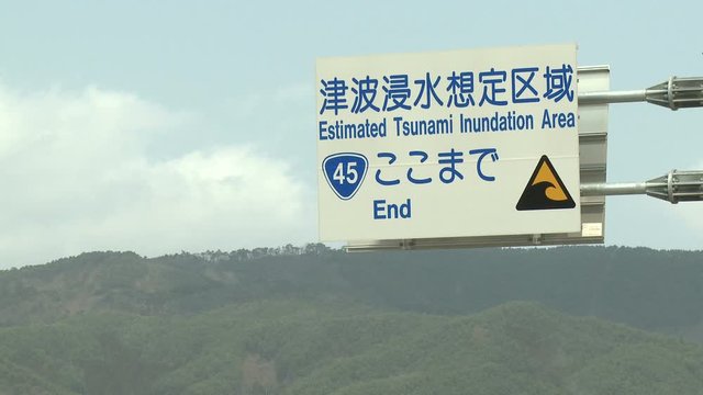 Japan Tsunami Aftermath - Tsunami Warning Sign On Highway