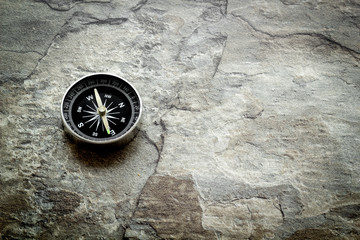 Compass - small and stylish - on grey background copy space