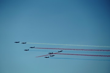 plane in the sky with colorful tracers 