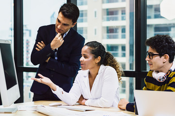 Young business design team having a meeting together in creative office.