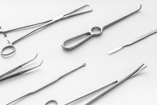 Instruments for plastic surgery on white background flat lay pattern