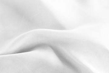 Closeup of rippled white silk fabric background