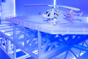 Model of the helipad. Place for helicopter landing. Helipad on the roof. Takeoff and landing of helicopters in hard-to-reach places. Maneuverable aircraft.
