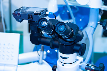 Medical microscope with built-in camera. Medical optics. Dental microscope with camera. Dental surgery. Carrying out operations under a microscope. Dental equipment close-up.