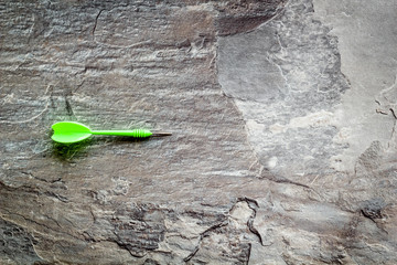 Plastic dart or arrows for darts game on grey background top view copy space