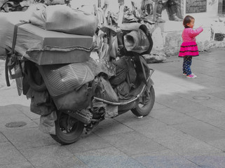 Happy little girl shows "Time to say Goodbye" with victory sign