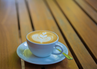 cup of coffee on wooden table