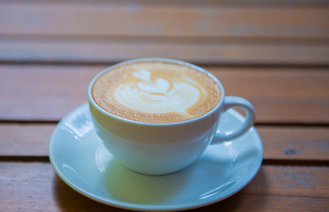 cup of coffee on wooden table