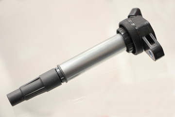 New car engine individual ignition coil on white background close up