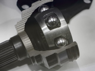 Car CV joint model in cut close up, ball joint tripod