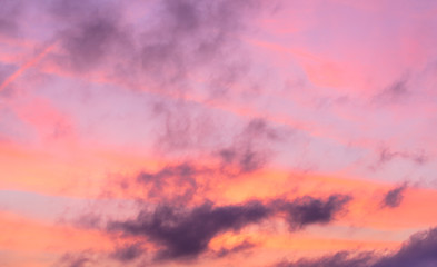 Beautiful pastel colored clouds against blue skies.