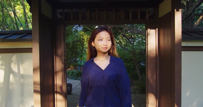 Asian Woman Walking Through Tropical Botanical Gardens, SLOW MOTION
