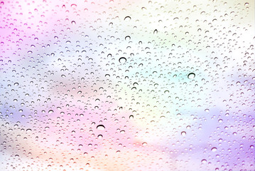 Colorful raindrops on glass.