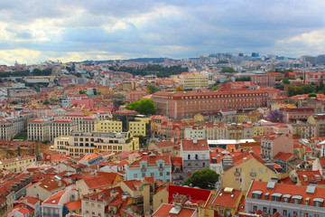 Fototapeta na wymiar Red roofs of old houses in Lisbon, Portugal, old Europe.