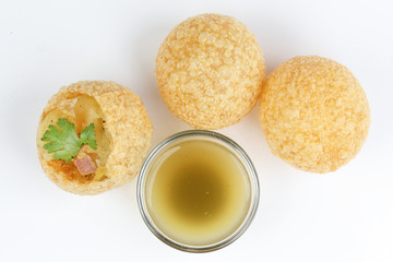 Tadeonal subcontinental street snack food chickpeas potato pani puri fuska with tamarind sauce © oqba