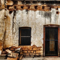 old wooden door in stone wall