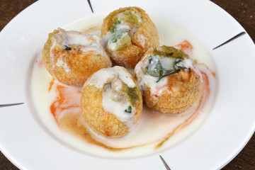 Tadeonal subcontinental street snack food chickpeas potato Dahi Puri Chaat pani puri fuska