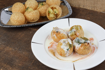 Tadeonal subcontinental street snack food chickpeas potato Dahi Puri Chaat pani puri fuska