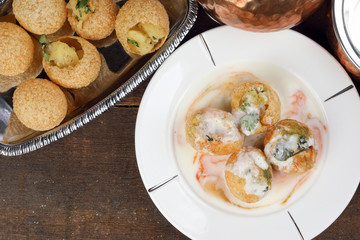 Tadeonal subcontinental street snack food chickpeas potato Dahi Puri Chaat pani puri fuska