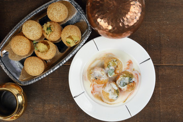 Tadeonal subcontinental street snack food chickpeas potato Dahi Puri Chaat pani puri fuska