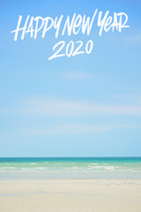 Fototapeta na wymiar happy new year 2020 text with blue ocean as a background