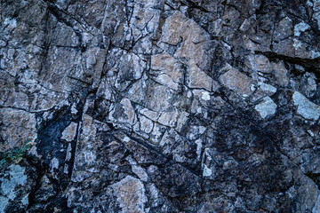 Texture of old scratched cracked grey stone