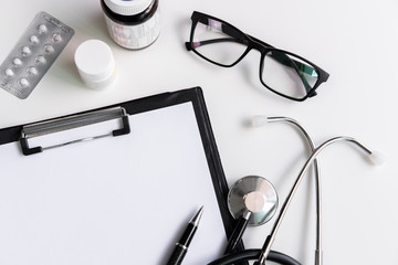 Stethoscope with clipboard and medicine, Top view, copy space, Healthcare concept