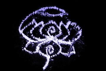 Indian traditional kolam (known in tamil language) or rangoli is drawn using white colored rice,...
