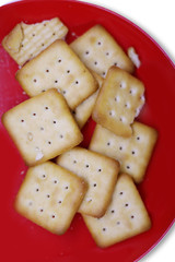 Top view Biscuits in Red plate on white background.