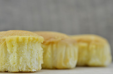 Delicious soft bread on a wooden background
