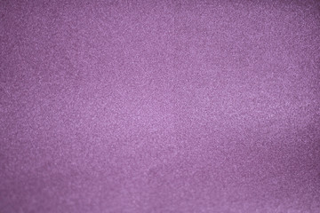 Background of light violet suede fabric closeup. Velvet matt texture of lilac nubuck textile