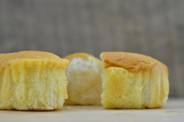 Soft bread open in half on a wooden background